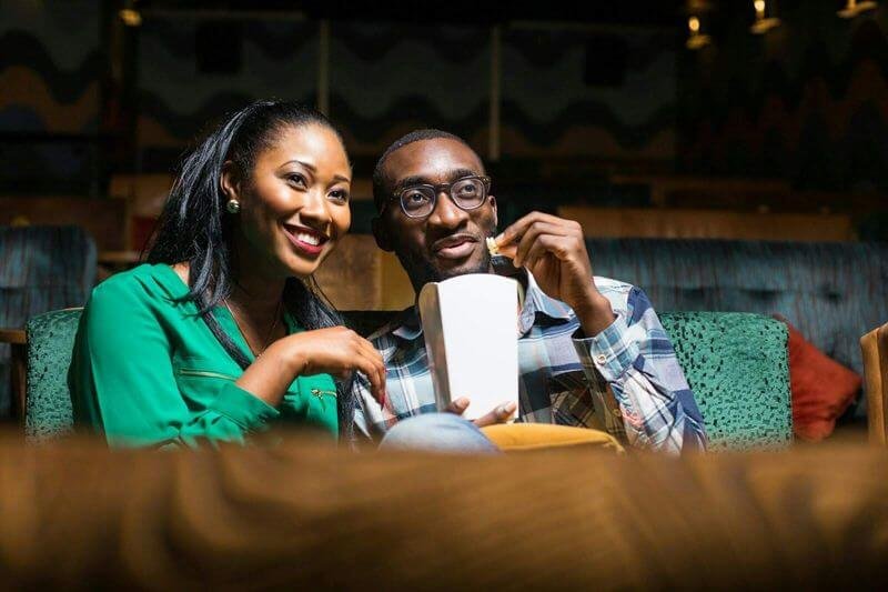 Tolulope and Chidinma Olajide watching a movie in a cinema